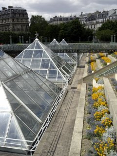 Pyramids cover a indoor garden area in the below ground mall of Les Halles, Paris.